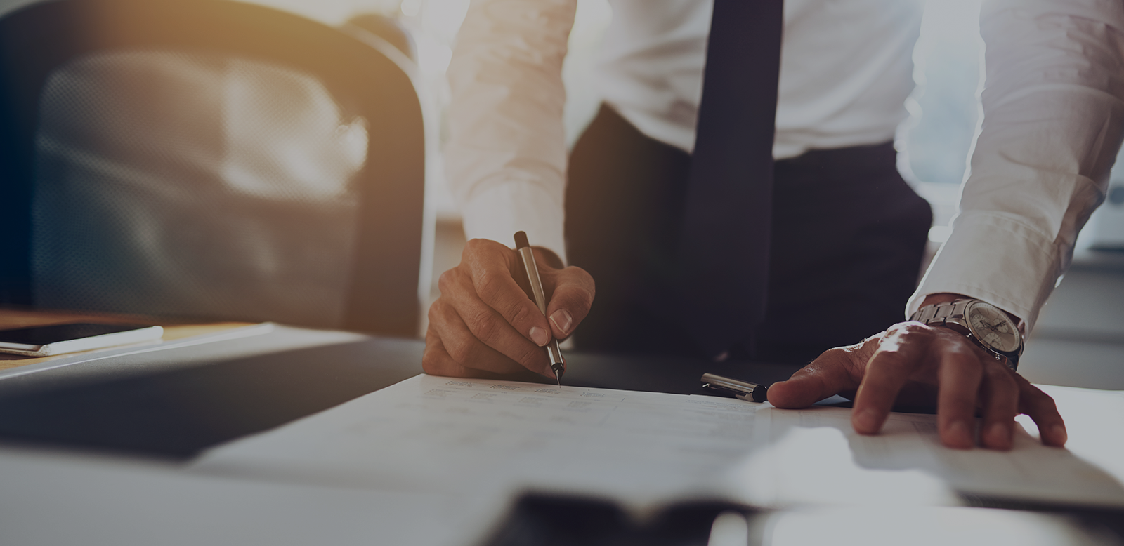 Lawyer signing document